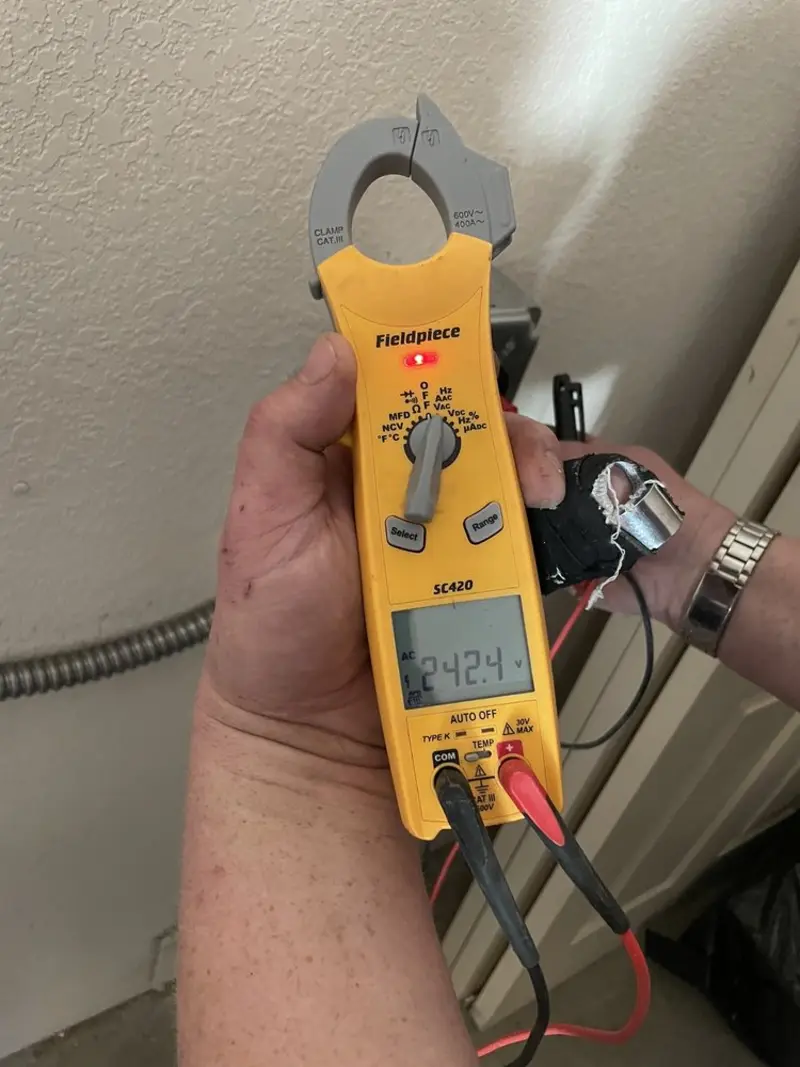 Voltage testing with clamp meter during Recessed Lighting Installation in Lake Providence